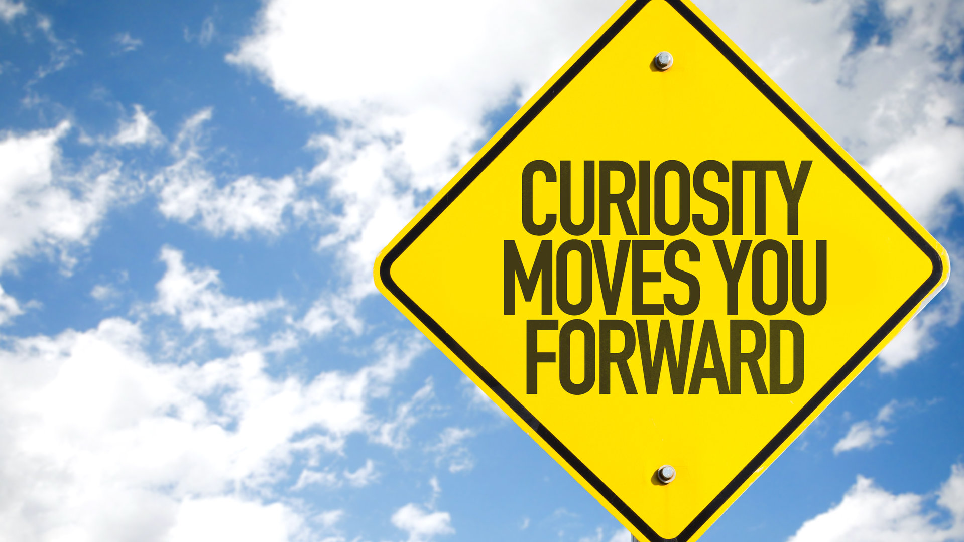 Curiosity moves you forward sign with clouds and sky background