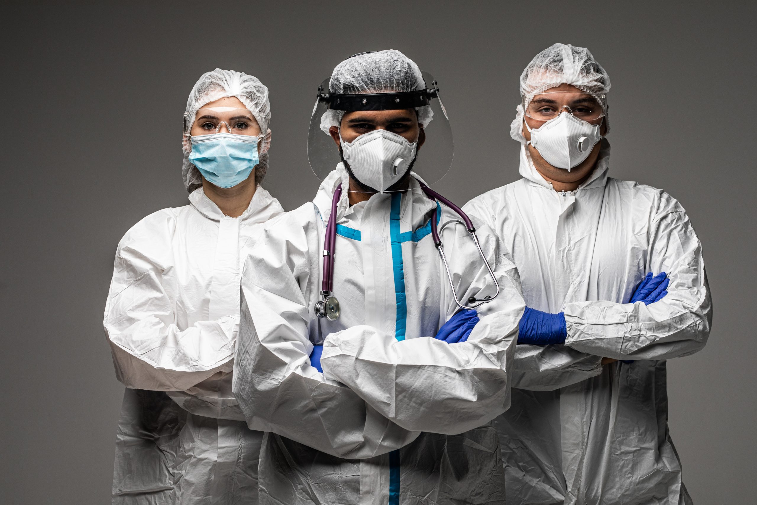 Doctors look to you wear the isolation gown or protective suits and surgical face masks in the control area to prevent the spread of coronavirus. Covid healthcare